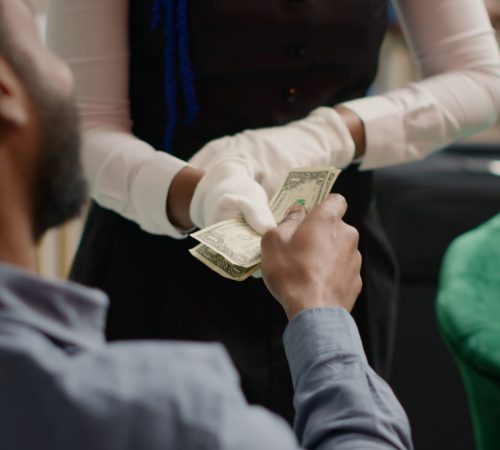 visitor pays cash for cup of coffee 2025 02 19 22 52 36 utc scaled